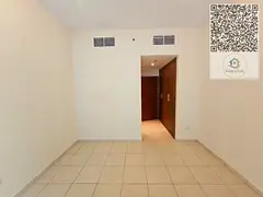 Two-bedroom apartment with a spacious living room for sale in Ajman One, one of the well-known resid