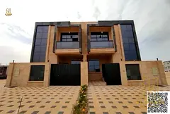For sale: Townhouse villa with a stone facade design. Price includes registration fees and freehold