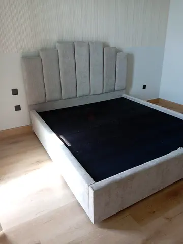 Elegant Fabric Bed with Unique Headboard Design
