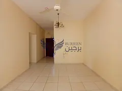 Spacious 2bhk apartment available in window ac central gas family building with balcony in al guwair