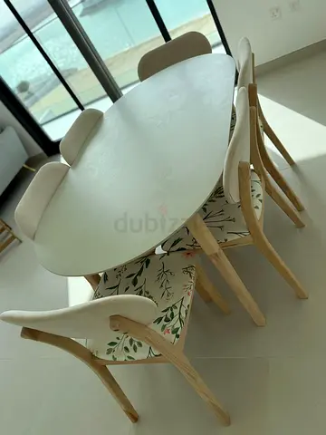 Elegant Oval Dining Table with Floral Chairs