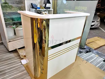 Elegant White Reception Desk with Gold Accents