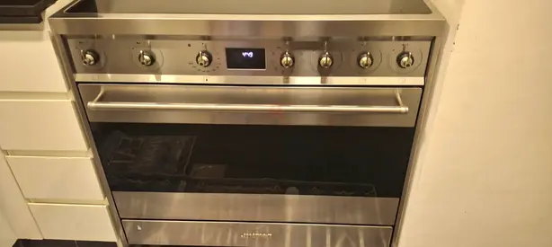 Induction cooking range cooktop oven electric dual fan grilling pan self cleaning option almost new