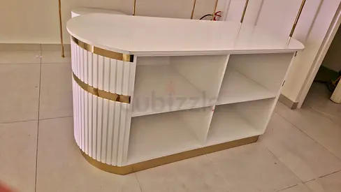 Modern White Reception Desk with Gold Accents