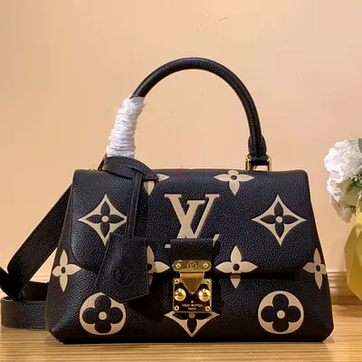 Louis Vuitton Madeleine Handbag in Bicolor Monogram Empreinte Embossed Grained Cowhide Leather