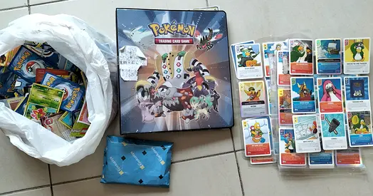Large Collection of Pokémon Cards with Storage Box