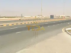 A prime investment opportunity in Al Manama 15. This commercial land is located directly on a main r