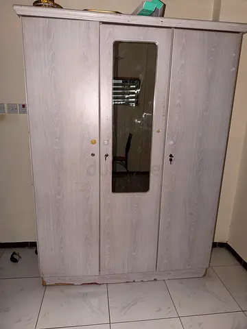 Modern Two-Door Wardrobe with Glass Front fixed rate 300 aed