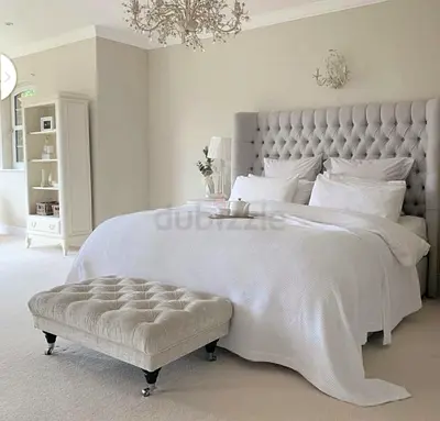 Elegant Queen Bed with Stylish Ottoman