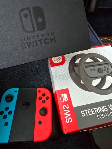Nintendo switch joy-con controllers + dock + steering wheel set