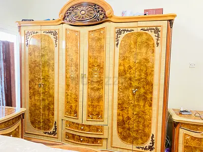Elegant Vintage Wardrobe with Intricate Designg