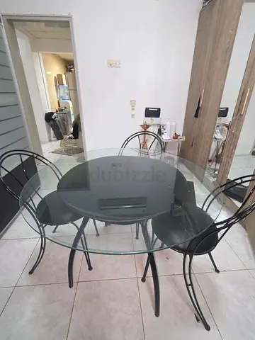 Stylish Round Glass Dining Table with 3 Black metal Chairs