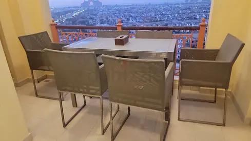 Outdoor dining table with six chairs
