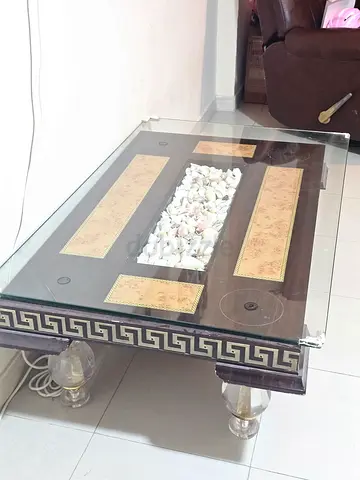 Elegant Glass Coffee Table with Decorative Centerpiece