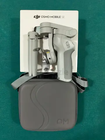DJI Osmo Mobile SE Gimbal Stabilizer with Carrying Case ( Price Negotiable )