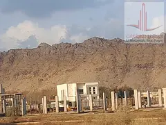 For Sale – Two Adjacent Residential Plots in Ajman, Masfout Basin 1