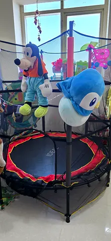 kids trampoline with safety net (IDEAL brand).