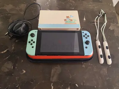Nintendo Switch with Dock, carrying case, charger, and grips
