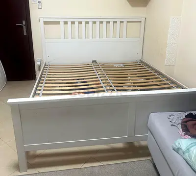 AED 250 King size,IKEA wooden bed frame in white stain color for sale. Good condition.