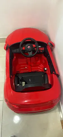 Red Battery-Powered Ride-On Car for Kids