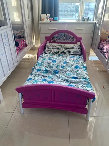 Stylish Pink Toddler Bed with Floral Design