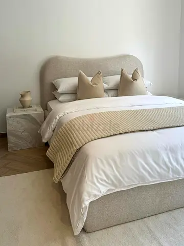 Elegant and Cozy Beige Upholstered Bed