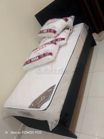 Comfortable Single Bed with Soft Mattress and Pillows