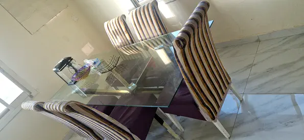 Modern Glass Dining Table with Stylish Chairs