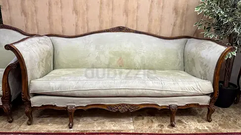 Elegant Vintage Sofa with Intricate Wood Detailing