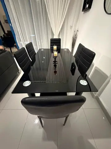 Modern Glass Dining Table with Black Chairs