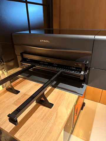 XTool P2S Laser Engraver, plus Raiser upgrade and auto material rollers for thicker materials.