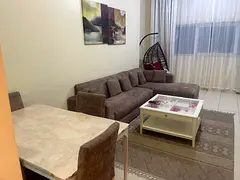 Furnished 1BR in Ajman One Towers, prime location, large layout, all bills included, near Sharjah Co
