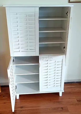 Stylish White Storage Cabinet with Slatted Doors