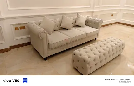 Elegant Beige Chesterfield Sofa with Matching Ottoman