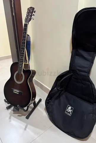 Beautiful Guitar with Bag and stand. Carrrom board with coins