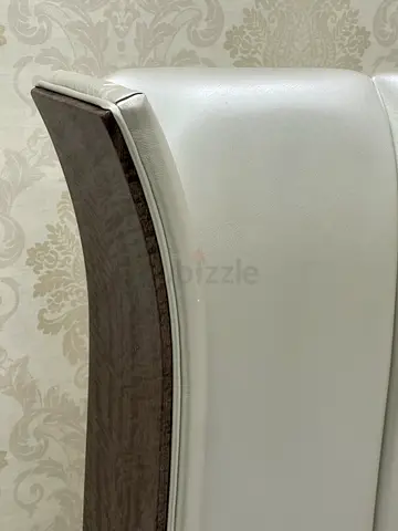 A high-quality bed from Home Centre with under-bed storage and two bedside tables.