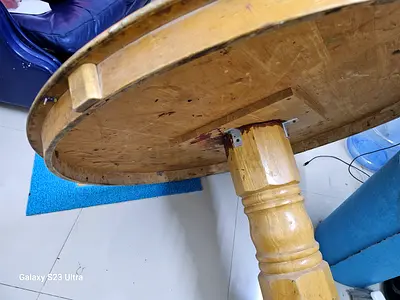 Solid round wooden dining table in good condition