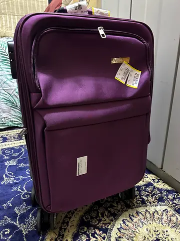 Purple Rolling Luggage in Excellent Condition