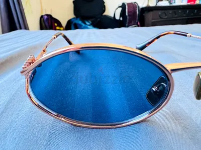 Miu Miu MU 52YS-ZVF1V1 sunglasses – rose gold frame, blue lenses