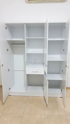 Selling brand new 3 door cabinet