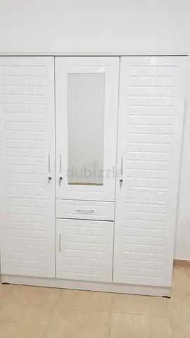 Im selling brand new 3 door cabinet