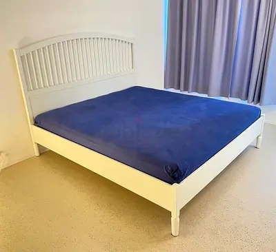 white wooden bed