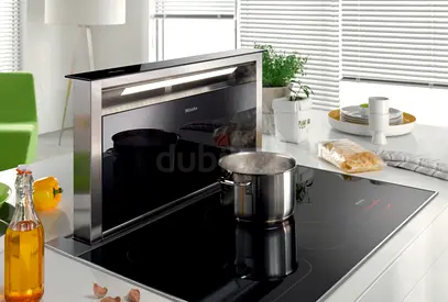 Miele Induction Cooktop with downdraft exhausted hood