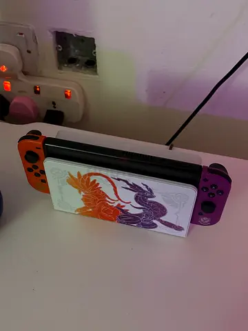 Nintendo Switch OLED - Colorful Design with Pokémon Art price can very depending on additional items