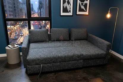 IKEA Sofa Bed with smart pull-out function and hidden storage compartment. Upholstered in premium fa