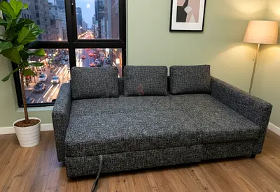 IKEA Sofa Bed easily converts into a comfortable sleeping area while offering built-in storage for a