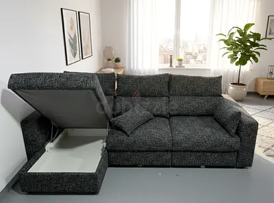 IKEA L-shaped sofa bed with built-in storage, designed for smart and stylish living. Upholstered in