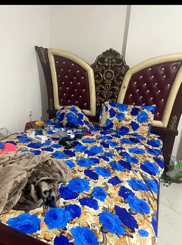 Elegant Upholstered Bed with Decorative Headboard