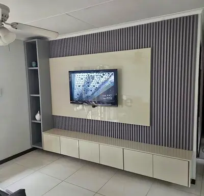 Temple cupboard • Kitchen Cabinets • Wooden Flooring. • TV media wall Unit.