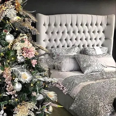 Elegant Grey Upholstered Bed with Luxurious Bedding